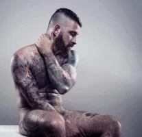 hairy-beefy-tattooed-sexy-dude-naked.webp
