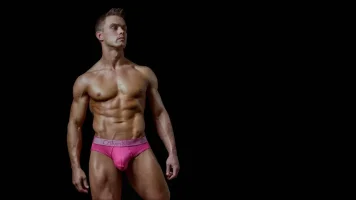 3322-athletic-guy-in-pink-calvin-klein-briefs.webp