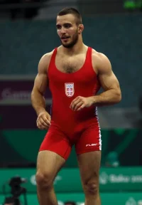 muscled-fighter-spandex-singlet-bulge-.webp