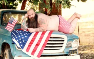 patriotic-man-on-truck.webp