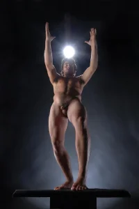 1845-powerful-male-nude-on-platform-reaching-up-chris-maher.webp